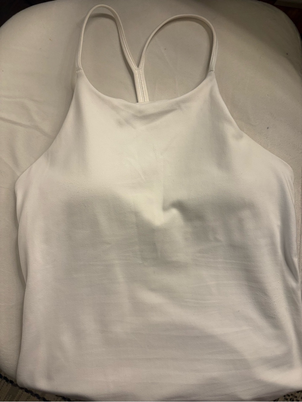 White lululemon halter style top with a built in bra.